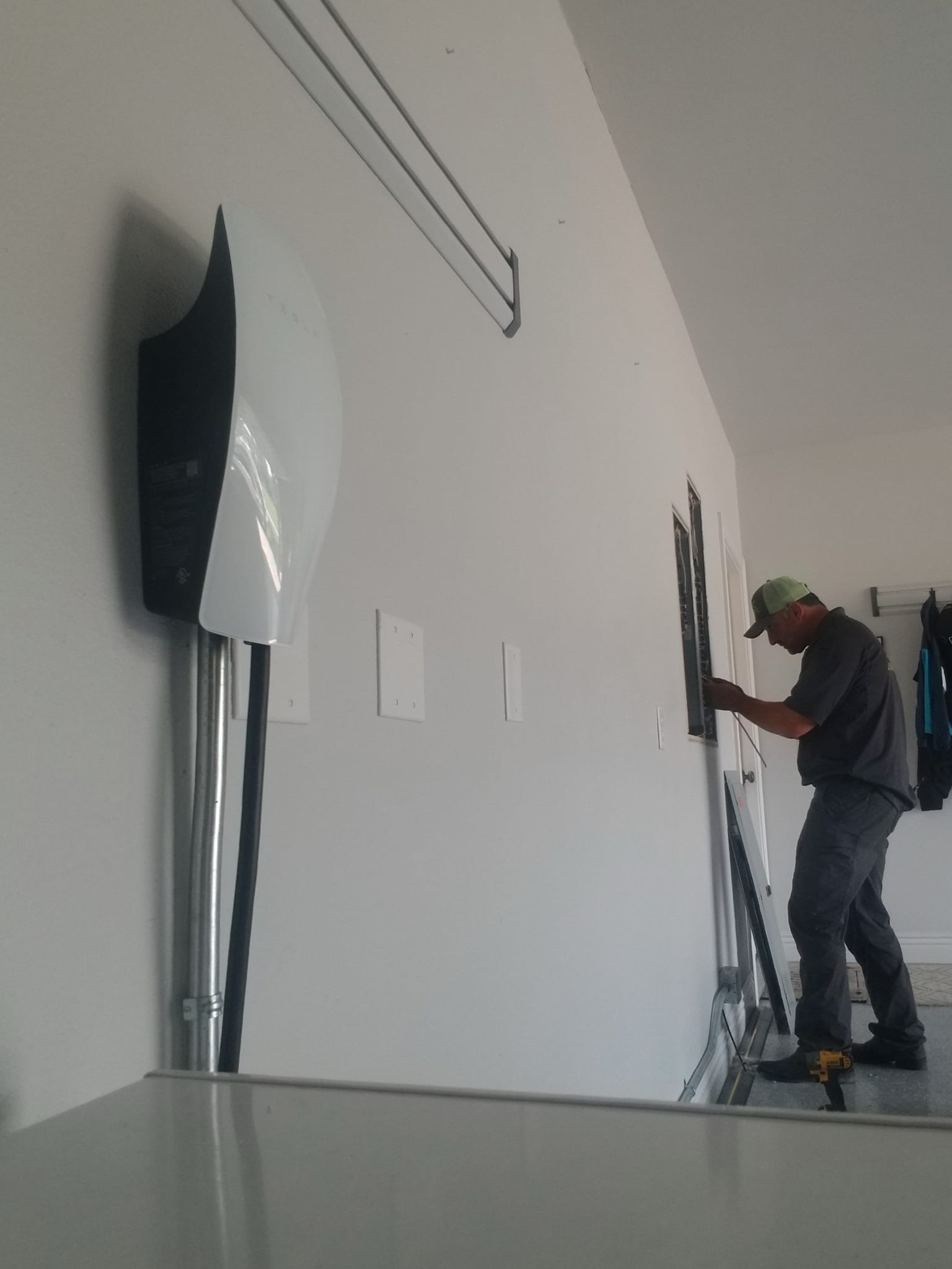 Level 2 EV charger installation in a home garage in Rogers, Arkansas